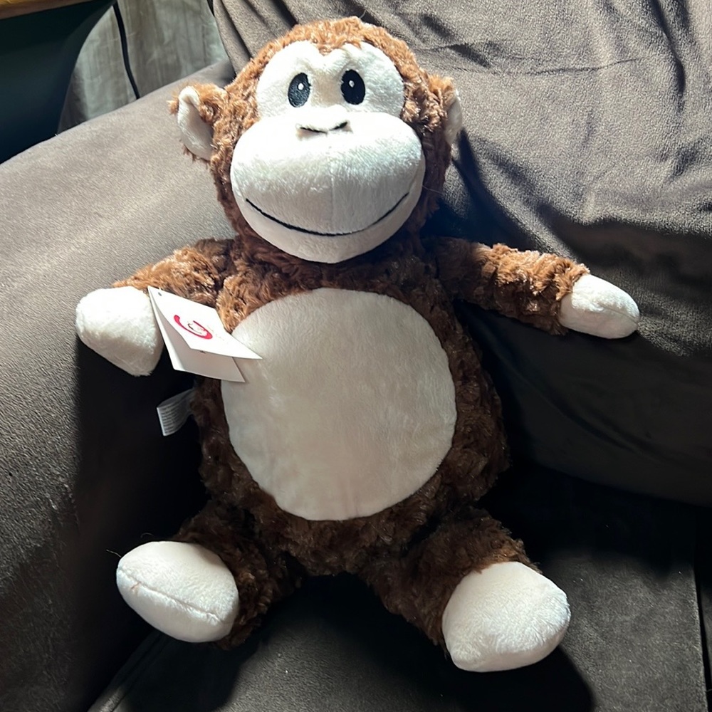 Cubbies stuffed monkey with tag still attached. Has a zip design so you …